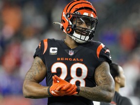Bengals working encourage Joe Mixon warms up sooner than a sport in opposition to the Funds in Cincinnati, Jan. 2, 2023.