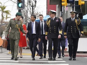 Britain's Prime Minister Rishi Sunak, left to right, Col Jaimie Norman, Admiral Sir Ben Key, First Sea Lord, and Commander Gus Carnie during Sunak's visit to San Diego, Monday March 13, 2023, ahead of his meetings with U.S. President Joe Biden and Prime Minister of Australia Anthony Albanese as part of AUKUS.