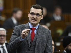 Conservative MP Tom Kmiec rises during Question Period in the House of Commons on Parliament Hill in Ottawa on Friday, March 10, 2023. Kmiec says a proposal to skip citizenship oath ceremonies and become a Canadian with the click of a mouse "cheapens" an otherwise special moment for newcomers.