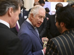 King Charles speaks to members of the Commonwealth community during the annual Commonwealth Day reception at Buckingham Palace in London, Monday March 13, 2023.