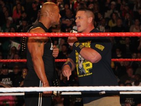 The Rock, left, and John Cena go toe to toe during their now legendary WrestleMania battles.