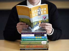 A pile of challenged books appear at the Utah Pride Center in Salt Lake City on Dec. 16, 2021. Attempted book bannings and restrictions at school and public libraries continue to surge, according to a new report from the American Library Association.