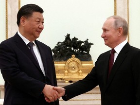 Russian President Vladimir Putin shakes hands with Chinese President Xi Jinping during a meeting at the Kremlin in Moscow, Russia, March 20, 2023.