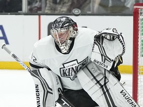 Los Angeles Kings goaltender Jonathan Quick deflects a shot during the first period of an NHL hockey game against the Arizona Coyotes Saturday, Feb. 18, 2023, in Los Angeles.