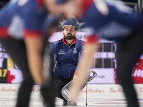 Wild Card Team 2 skip Reid Carruthers of the Morris Curling Club in Manitoba watches his shot during his team's match against the Northwest Territories at the 2023 Tim Hortons Brier at Budweiser Gardens in London, Ont., Sunday, March 5, 2023.