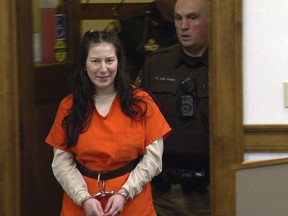 Taylor Schabusiness returns to a Brown County courtroom after attacking her attorney Quinn Jolly, during a hearing in Green Bay, Wis., Feb. 14, 2023.