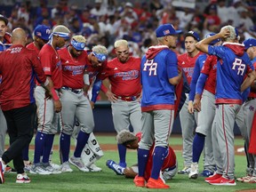Edwin Diaz of Puerto Rico lies hurt on the field after celebrating a 5-2 win against the Dominican Republic during their World Baseball Classic game at loanDepot park on March 15, 2023 in Miami.