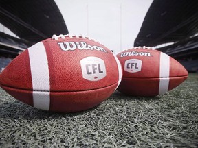 CFL balls are photographed at the Winnipeg Blue Bombers stadium in Winnipeg Thursday, May 24, 2018. Ontario's labour ministry says it's reviewing concerns brought forward by the Canadian Football League Players' Association and other professional athlete unions.
