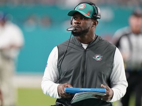 Miami Dolphins head coach Brian Flores stands on the sideline during the second half of an NFL football game against the New England Patriots, Jan. 9, 2022, in Miami Gardens, Fla.