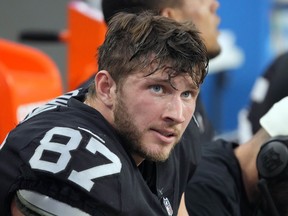 Las Vegas Raiders tight end Foster Moreau (87) watches from the sideline during an NFL game against the Kansas City Chiefs, Saturday, Jan. 7, 2023, in Las Vegas.