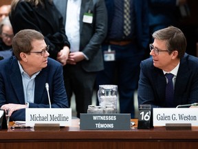 Michael Medline, president and CEO of Empire Co. Ltd., left, and Galen Weston, chairman and president of Loblaw Cos. Ltd., wait to appear as witnesses at the Standing Committee on Agriculture and Agri-Food investigating food price inflation in Ottawa, March 8, 2023.