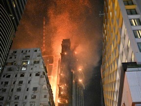A fire breaks out in an office building in Tsim Sha Tsui, in Hong Kong on early March 3, 2023.