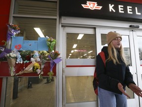 Sofia Barysh, (pictured) a university student at Toronto Metropolitan University places flowers at the memorial on Monday, March 27, 2023, for murder victim Gabriel Magalhaes, 16, who who was stabbed to death Saturday night, in an unprovoked attack at Keele TTC station.