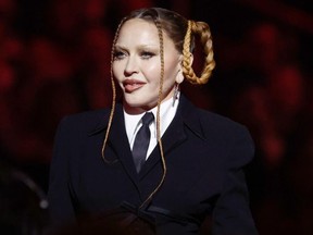 Madonna speaks onstage during the 65th Grammy Awards.