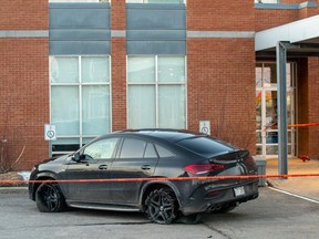 Bullet holes can be seen in the driver's side window and door of a Mercedes GLE 53 in Laval on Wednesday, March 15, 2023, after an apparent assassination attempt on Leonardo Rizzuto.