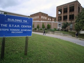 Visitors walk toward Building 114, the S.T.A.R. Center, at Central State Hospital in Dinwiddie County, Va., May 17, 2018.