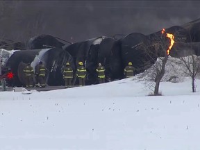 Emergency personnel respond to the scene of a train derailment early Thursday, March 30, 2023 in Raymond, Min.