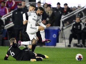 Toronto FC forward Insigne, front top, pursues the ball past D.C. United midfielder Russell Canouse (6) and midfielder Mateusz Klich, back, during the first half of an MLS soccer match, Saturday, Feb. 25, 2023, in Washington.