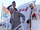 Prince Charles and Camilla, Duchess of Cornwall, disembark their plane in Yellowknife during part of the Royal Tour of Canada, May 19, 2022. 