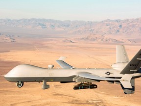 This handout photo courtesy of the U.S. Air Force obtained on Nov. 7, 2020 shows an MQ-9 Reaper unmanned aerial vehicle (UAV or drone) flying over the Nevada Test and Training Range on Jan. 14, 2020.