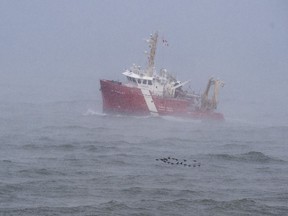 The CGGS M. Perley searches the waters of the Bay of Fundy in Hillsburn, N.S. on Wednesday, Dec. 16, 2020 as they continue to look for five fishermen missing after the scallop dragger Chief William Saulis sank in the Bay of Fundy.