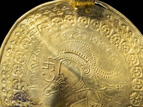 The inscription ‘He is Odin’s man’ is seen in a round half circle over the head of a figure on a golden bracteate unearthed in Vindelev, Denmark in late 2020