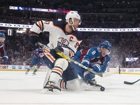 Edmonton Oilers center Connor McDavid and Colorado Avalanche defenseman Cale Makar tangle during the first period in Game 2 of the Western Conference NHL Hockey Stanley Cup playoffs on Thursday, June 2, 2022, in Denver .