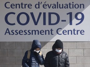 People leave a COVID-19 assessment centre Saturday, March 14, 2020 in Ottawa.