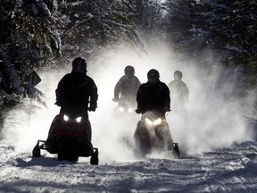 Snowmobilers take to the trails near Kinmount, Ont., on Jan. 23, 2021.