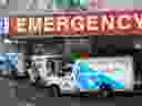 A paramedic closes the doors of an ambulance at a hospital in Toronto, April 6, 2021.