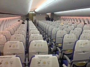 Empty seats are seen during a flight from Singapore to Bangkok March 4, 2020.