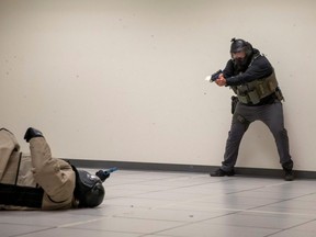 A law enforcement officer shoots a non-lethal weapon at a U.S. Marshal holding a non-lethal weapon during a United States Marshals Service Officer Safety Training - Human Performance session in Birmingham, Alabama, March 23, 2023.