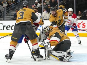 Golden Knights goaltender Jonathan Quick makes a save as Vegas Golden Knights defenceman Brayden McNabb looks to check Montreal Canadiens' Rafael Harvey-Pinard during the second period at T-Mobile Arena on Sunday, March 5, 2023.