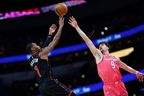 Raptors' Will Barton (left) shoots the ball as Wizards' Deni Avdija defends in the second quarter at Capital One Arena on Thursay, March 3, 2023. 