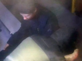 Toronto Police are asking the public to help identify two suspects who stole a downtown restaurant's cash box this week.