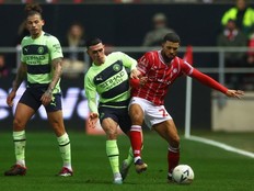 Soccer Football - FA Cup - Fifth Round - Bristol City v Manchester City - Ashton Gate Stadium, Bristol, Britain - February 28, 2023 Bristol City's Nahki Wells in action with Manchester City's Phil Foden .