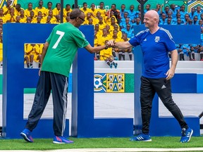 FIFA president Gianni Infantino and Rwanda's President Paul Kagame arrive at the reopening Nyamirambo Stadium which has changed its name to Pele Stadium, during the 73rd FIFA Congress Delegation Football Tournament in Kigali, Rwanda March 15, 2023.