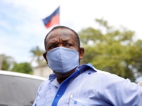 Yves Jean-Bart, president of the Haitian Football Federation, wearing a protective face mask, arrives at a hearing at the Crois-Des-Bouquets prosecutor's office. Crois-Des-Bouquets, Haiti, May 14, 2020.