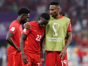 Canada's Richie Laryea and Mark-Anthony Kaye look dejected after being eliminated from the World Cup. The team reunites to face Curacao on March 25. REUTERS