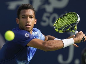 Canada's Felix Auger-Aliassime returns the ball to Maxime Cressy of the U.S. during a match of the Dubai Duty Free Tennis Championships in Dubai, United Arab Emirates, Tuesday, Feb 28, 2023. Auger-Aliassime was eliminated in the second round of the Dubai Tennis Championships with a 7-6 (4), 6-4 loss to Italy's Lorenzo Sonego on Wednesday.
