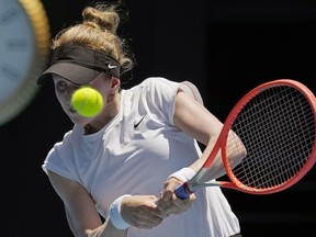 Katherine Sebov of Canada plays a backhand return to Caroline Garcia of France during their first round match at the Australian Open tennis championship in Melbourne, Australia, Tuesday, Jan. 17, 2023. Vancouver's Rebecca Marino and Toronto's Sebov have advanced to the second round of the Miami Open.
