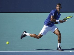 Felix Auger Aliassime, of Canada, returns a volley against Thiago Monteiro, of Brazil, in the first set of a match at the Miami Open tennis tournament in Miami Gardens, Fla., Saturday, March 25, 2023. Auger-Aliassime is out of the Miami Open after being upset 6-2, 7-5 in a third-round match with Argentina's Francisco Cerundolo.