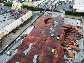 An aerial view of roof damage after a possible tornado touched down and ripped up buildings in a Los Angeles suburb on March 22, 2023 in Montebello, California.