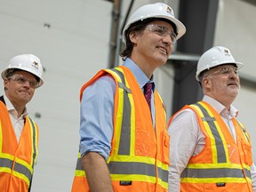 Saskatoon Mayor Charlie Clark, Prime Minister Justin Trudeau and Vital Metals Managing Director John Dorward tour the Vital Metals rare earths element processing plant.