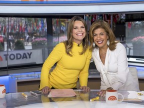 Co-anchors Savannah Guthrie, left, and Hoda Kotb pose on "Today" show set at NBC Studios on June 27, 2018, in New York.