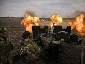 Ukrainian servicemen fire with a S60 anti-aircraft gun at Russian positions near Bachmut on March 20, 2023.