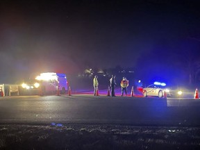 Emergency responders are seen near a site where two military helicopters crashed Wednesday night during a routine training mission in Trigg County, in southwestern Kentucky, on March 30, 2023.