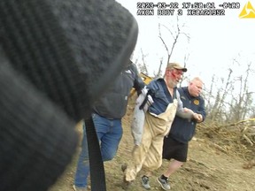 This still image from a March 12, 2023, police bodycam video released by the Pickaway County, Ohio, Sheriff's Office shows the injured owner of a zebra being taken to an ambulance after the animal attacked him.
