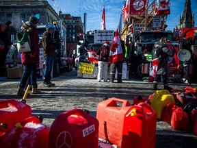 File photo: Gas tanks sit on the ground in front of Parliament Hill during last winter's convoy protest on Sunday, Feb. 13, 2022, day 17 of the protest. An Ottawa police investigation has fizzled in court after the accused was acquitted on all charges of mischief and police obstruction for aiding and abetting the protest by refilling jerry cans.