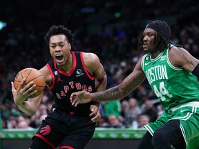 Toronto Raptors forward Scottie Barnes drives the ball against Boston Celtics centre Robert Williams III.